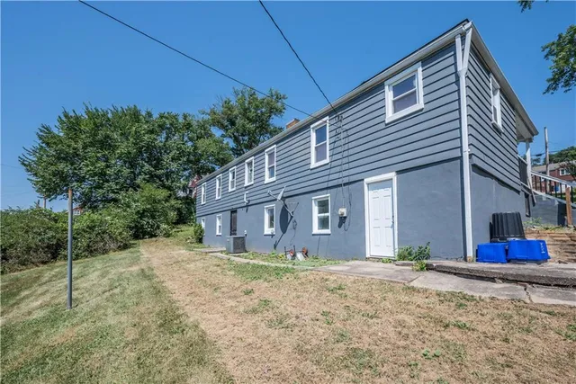 a house view with a backyard space