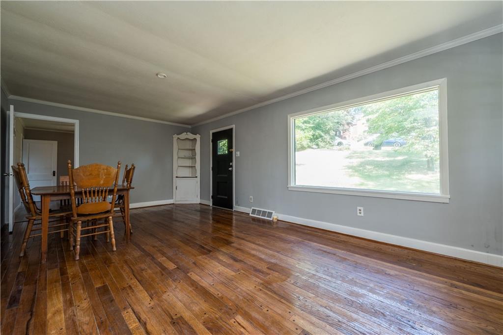10780 Old Trail Road Irwin, PA 15642 - Photo 6 of 45 a view of a dining room with furniture and wooden floor