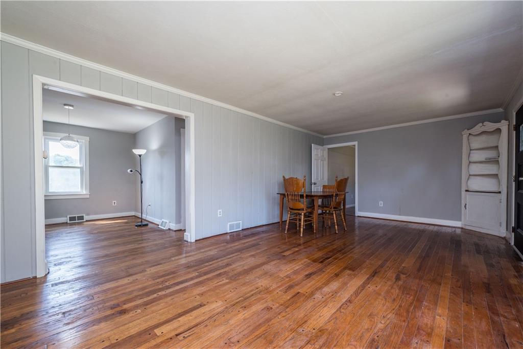 10780 Old Trail Road Irwin, PA 15642 - Photo 10 of 45 an empty room with furniture and wooden floor
