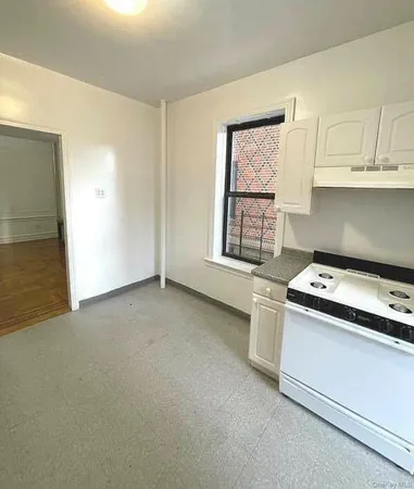a kitchen with a stove and a refrigerator