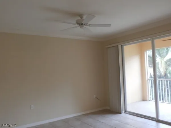 a view of a livingroom with a ceiling fan and window