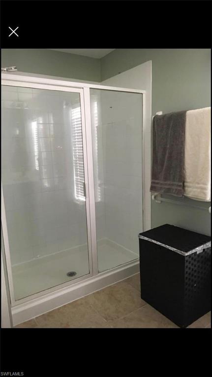 884 Hampton Circle, Unit 159 Naples, FL 34105 - Photo 13 of 28 a bathroom with a bathtub