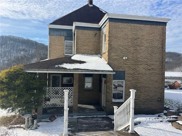 a front view of a house with glass windows
