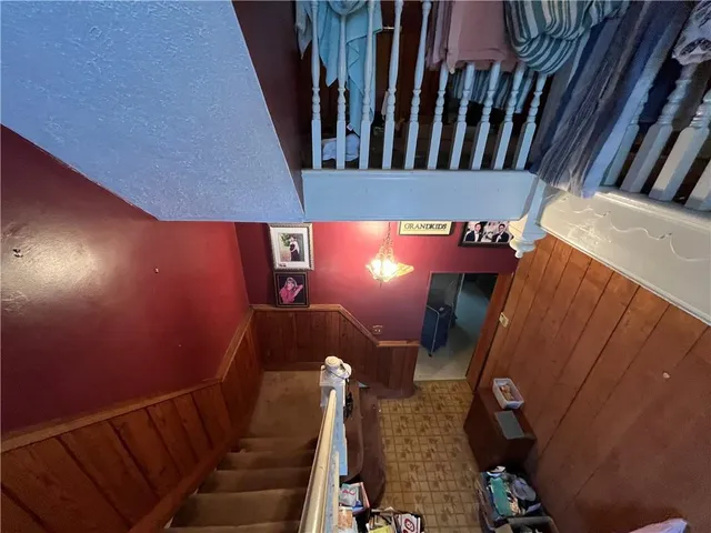 a living room with furniture a rug and a fireplace