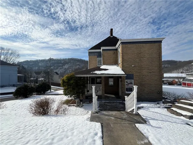 a view of a house with a patio
