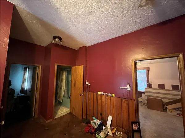 a living room with furniture and a lamp