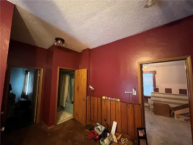 a living room with furniture and a lamp