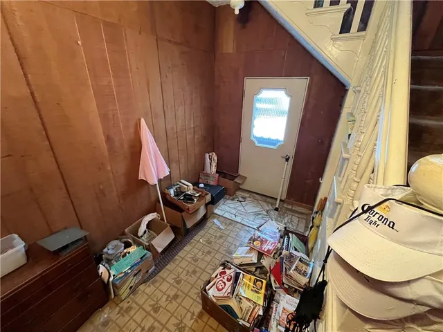 a living room with furniture and a mirror