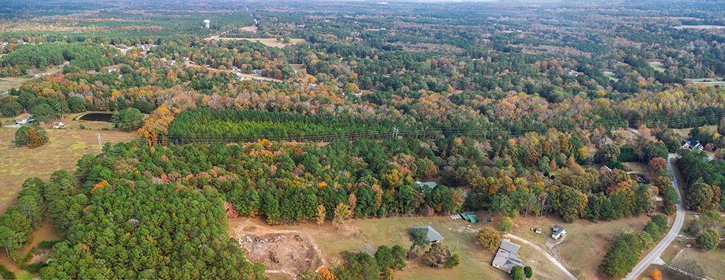 280 Dodgen Road Hampton, GA 30228 - Photo 6 of 8 an aerial view of residential houses with outdoor space and trees