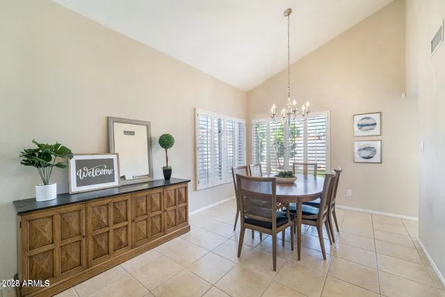 a dining room with furniture and window