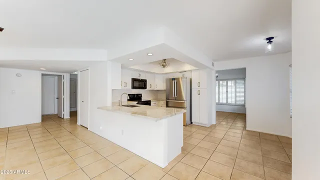 a kitchen with a refrigerator a sink and dishwasher