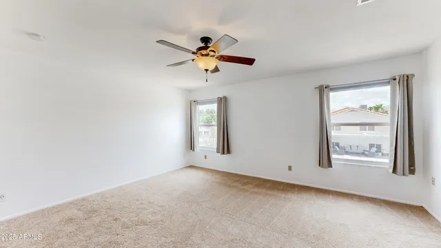 a view of staircase with white walls and stairs