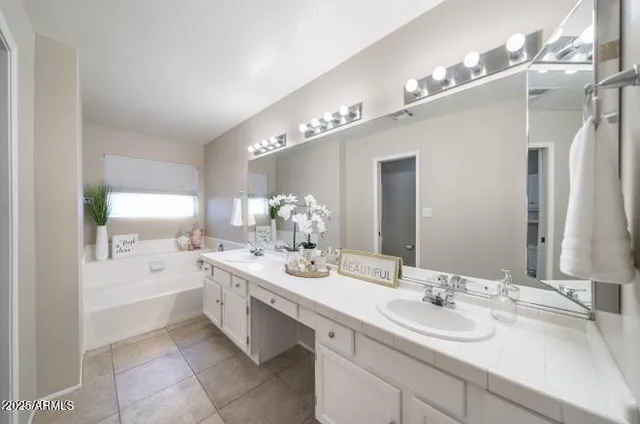 a spacious bathroom with a double vanity sink mirror and double