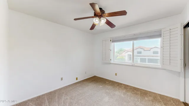 a patio with table and chairs