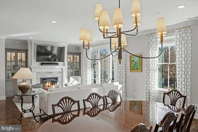 a living room with furniture a flat screen tv and white walls