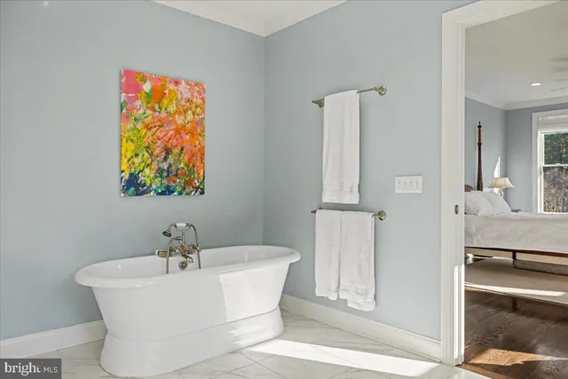 a spacious bathroom with a granite countertop sink a mirror a vanity and a shower
