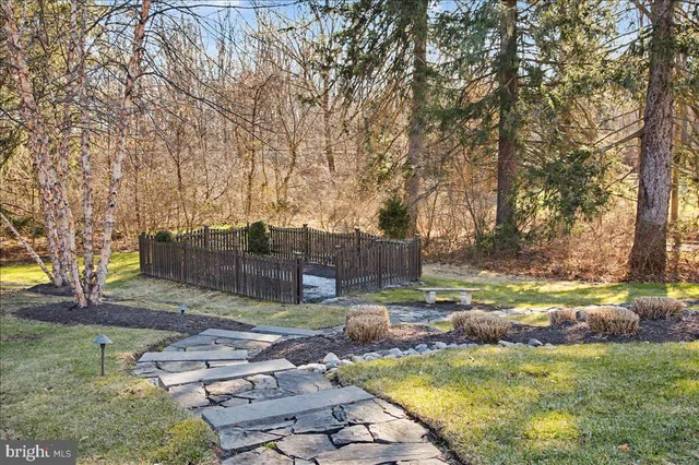 an aerial view of a house with a yard basket ball court and outdoor seating