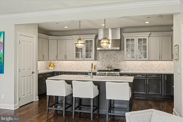 a kitchen that has a table and chairs in it