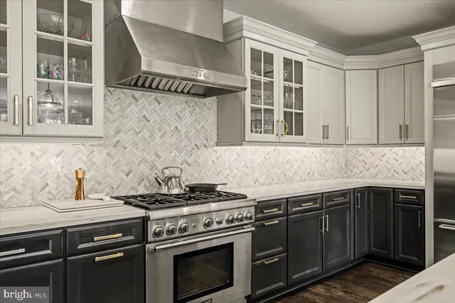 a kitchen with stainless steel appliances granite countertop a stove and a sink