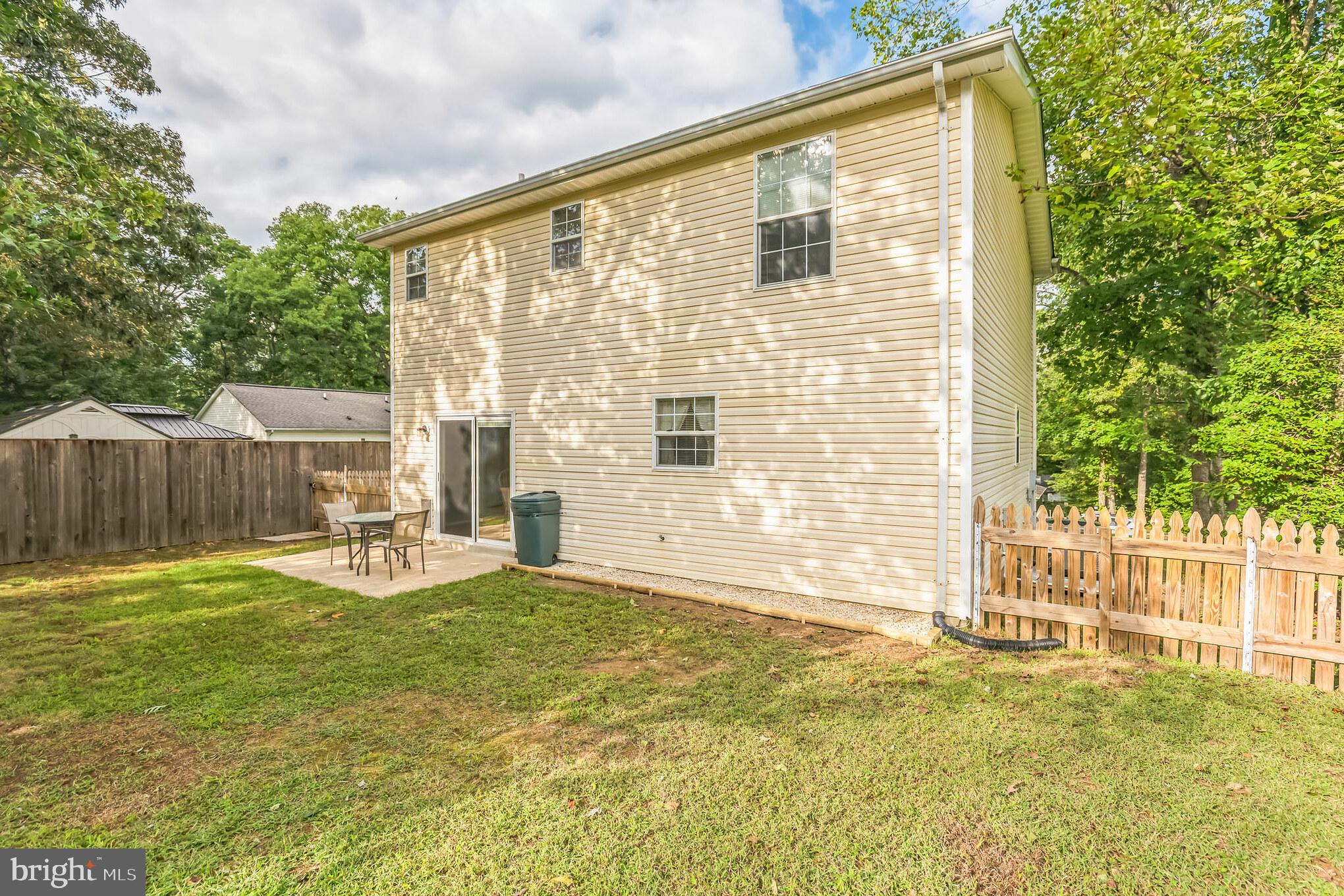 526 Maple Way Lusby, MD 20657 - Photo 24 of 26 a view of a house with backyard and wooden fence