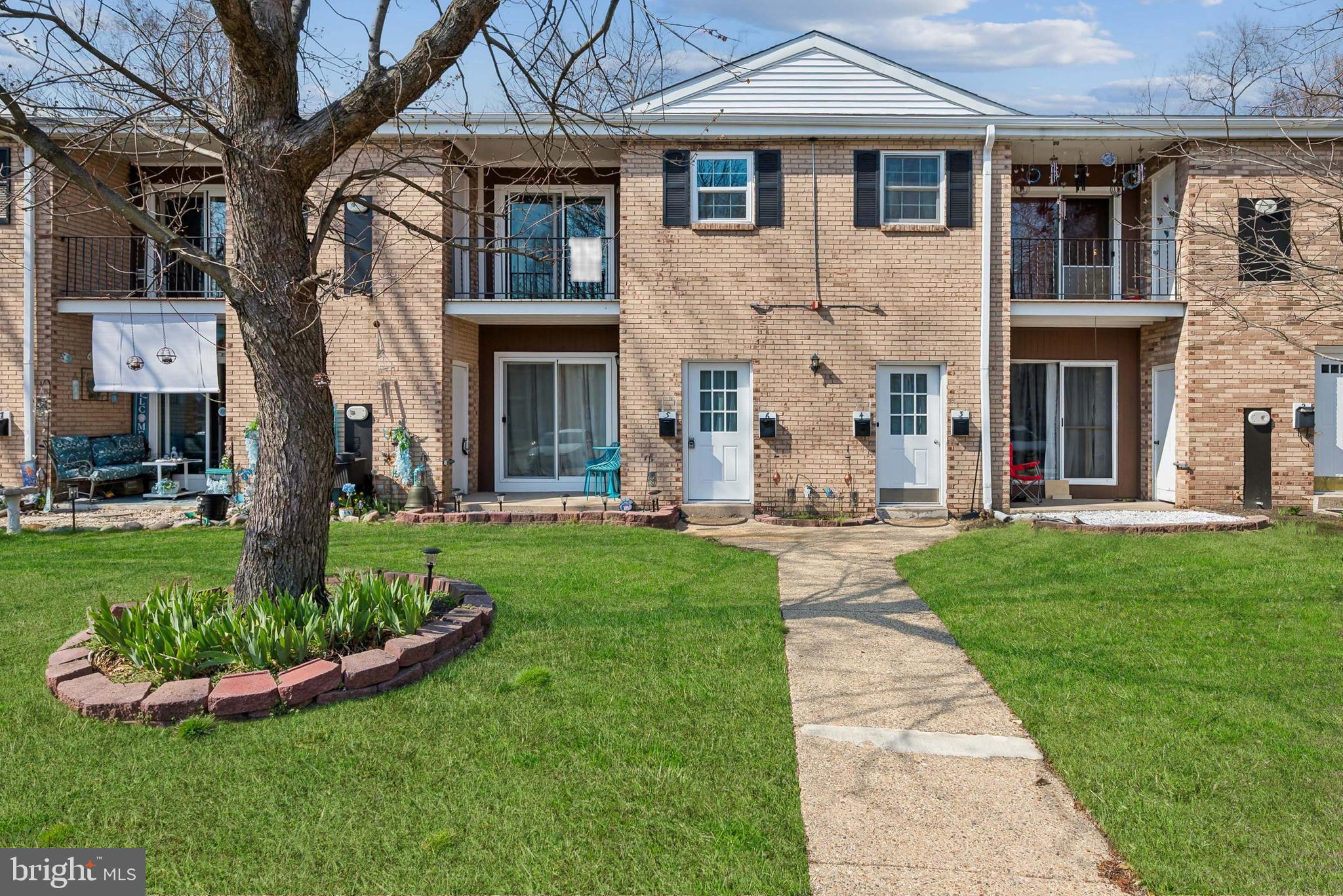 1294 Cooper Street, Unit C5 Edgewater Park, NJ 08010 - Photo 1 of 1 a front view of a house with a yard