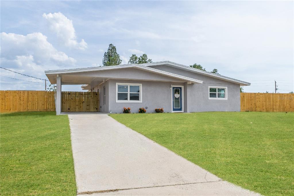 434 Hickory Road Venice, FL 34293 - Photo 1 of 1 Long Driveway leads to over-sized carport with carport entry through interior laundry room. Completely fenced with a 6' Privacy fence.