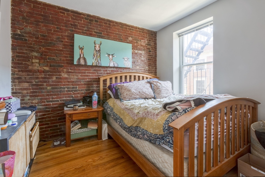 178 North Street, Unit 4 Boston, MA 02113 - Photo 8 of 8 a bedroom with a bed and a window