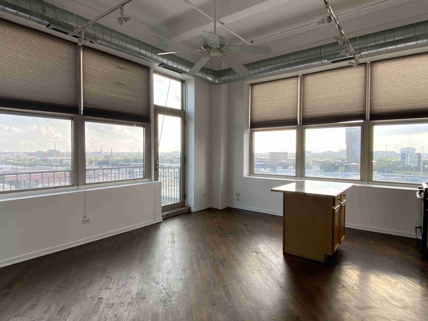 500 South Clinton Street, Unit 1017 Chicago, IL 60607 - Photo 4 of 11 a room with wooden floor and furniture
