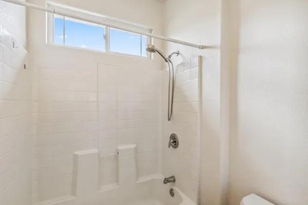 a bathroom with a shower and a shower