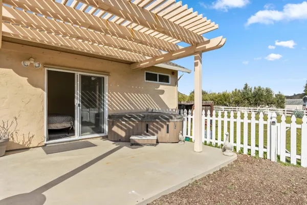a view of a garden with a bench in patio