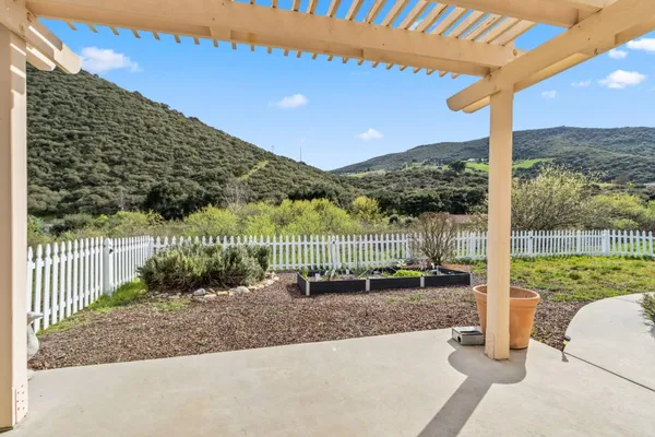 a view of a patio with a table chairs and a table