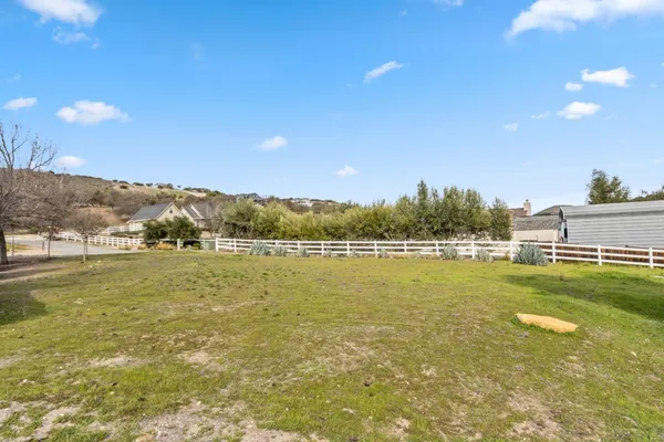 a view of a yard with a house