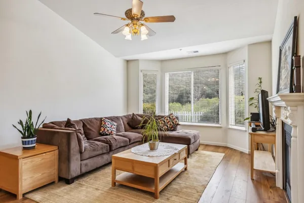 a living room with furniture and a large window
