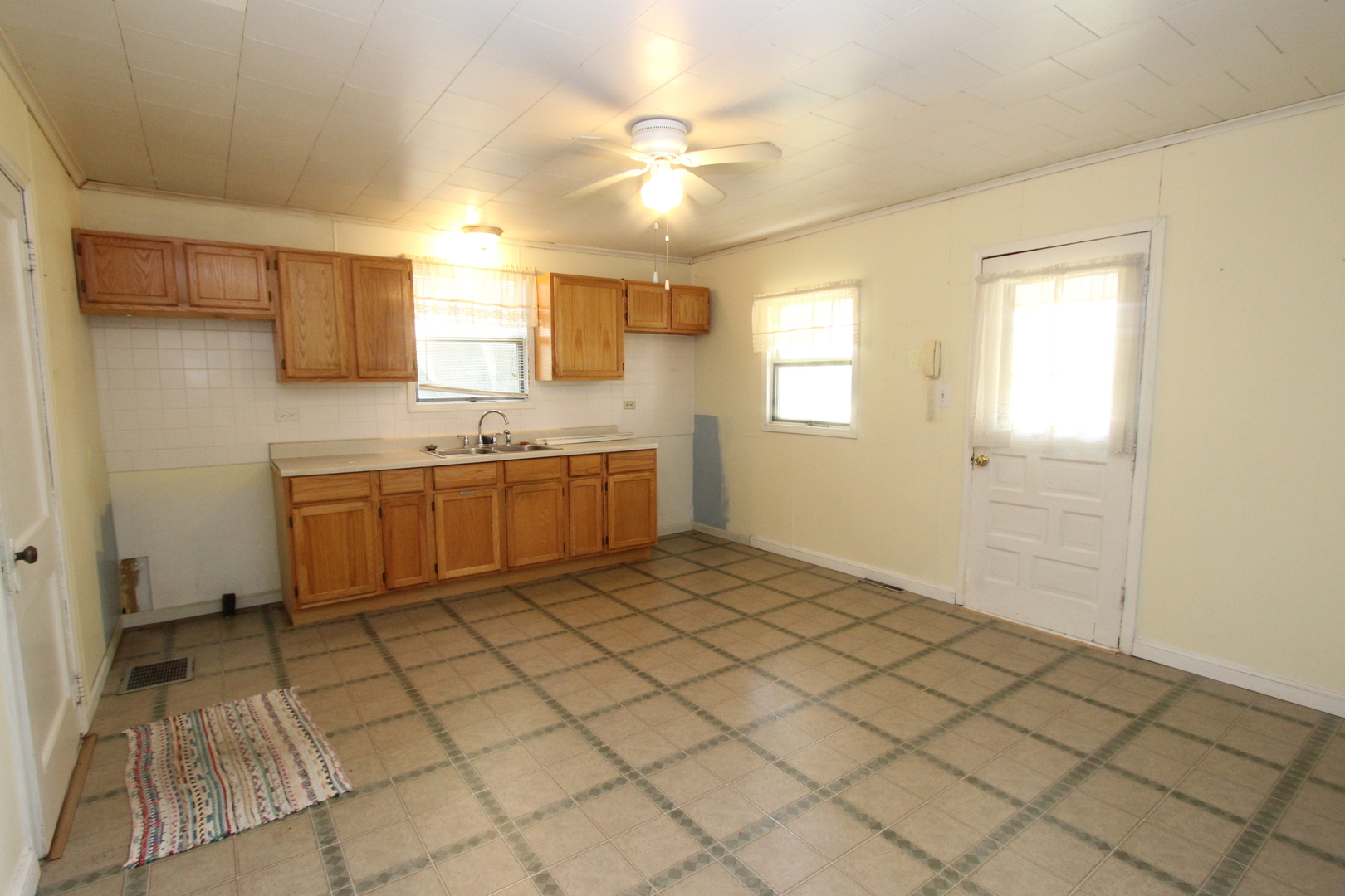 10714 Vanderkarr Road Hebron, IL 60034 - Photo 6 of 17 a view of a kitchen with a sink and cabinets