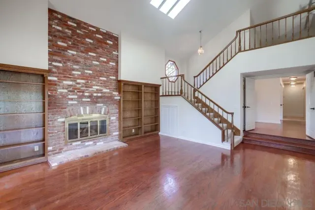 a kitchen with stainless steel appliances granite countertop white cabinets and sink