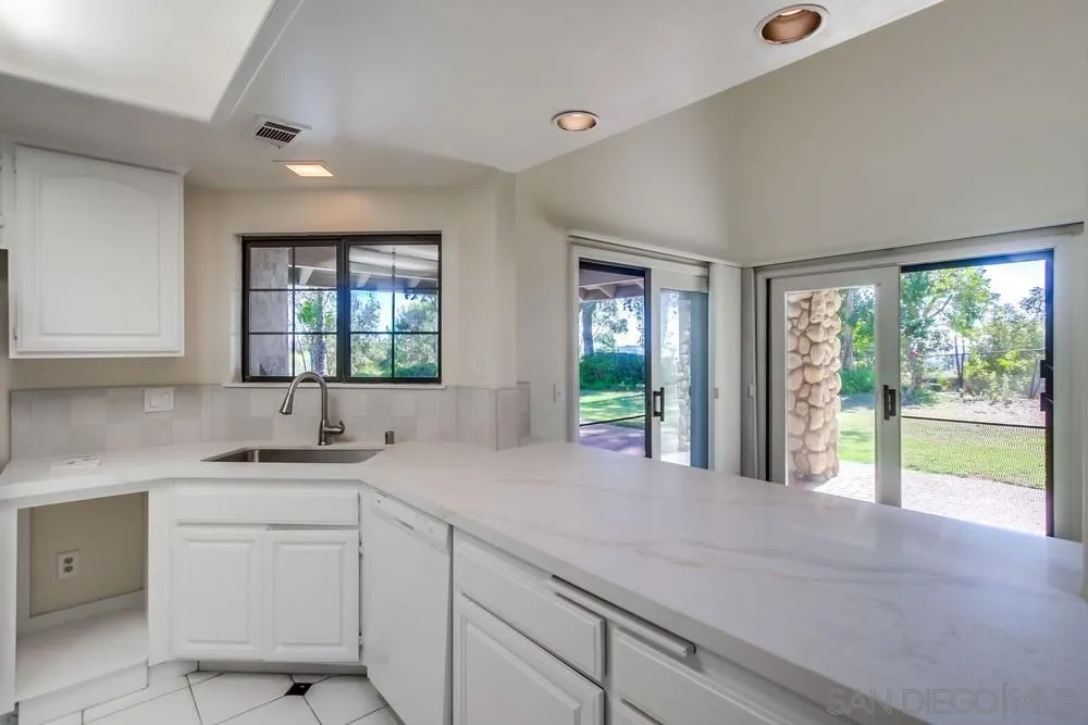 15235 Crestview Court Poway, CA 92064 - Photo 20 of 68 a kitchen with a sink and large window