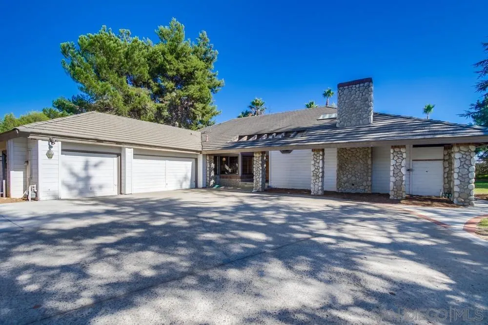 15235 Crestview Court Poway, CA 92064 - Photo 3 of 68 a front view of a house with a garden