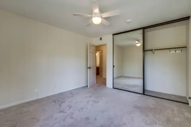 a view of a backyard with large trees