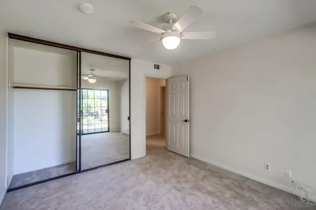 a view of a swimming pool with a yard