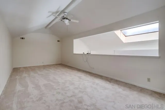 a view of a swimming pool with a yard and trees