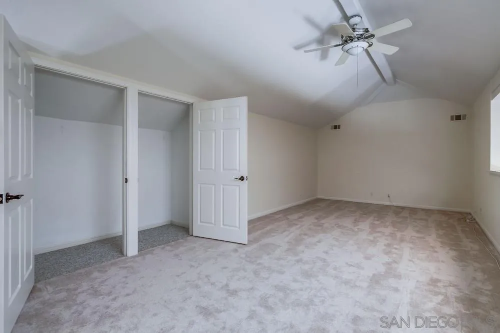 15235 Crestview Court Poway, CA 92064 - Photo 38 of 68 a view of a room with a ceiling fan and carpet
