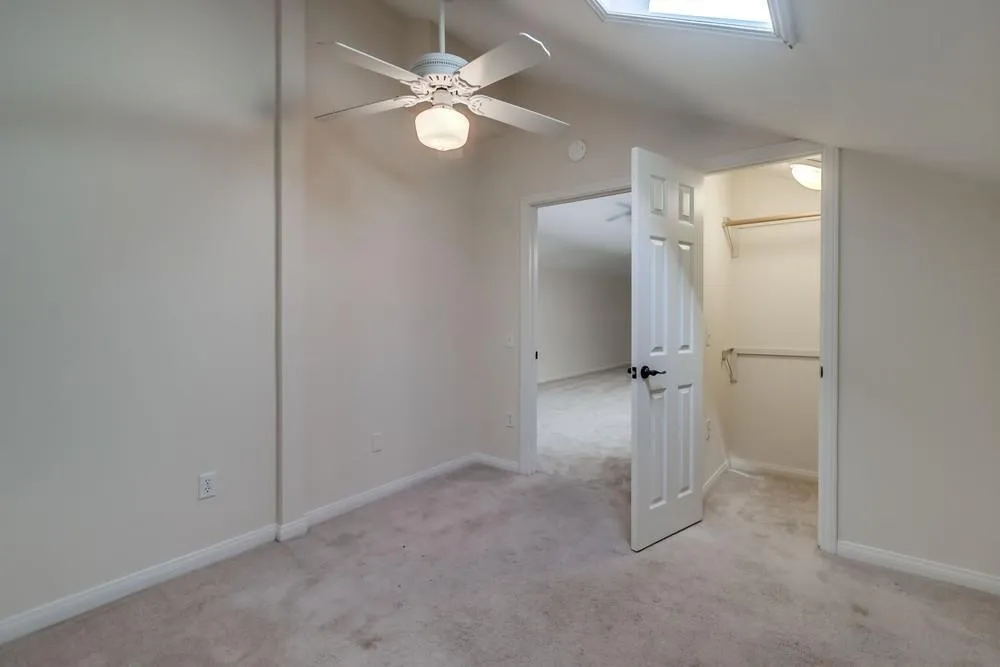 15235 Crestview Court Poway, CA 92064 - Photo 42 of 68 an empty room with closet and a chandelier fan