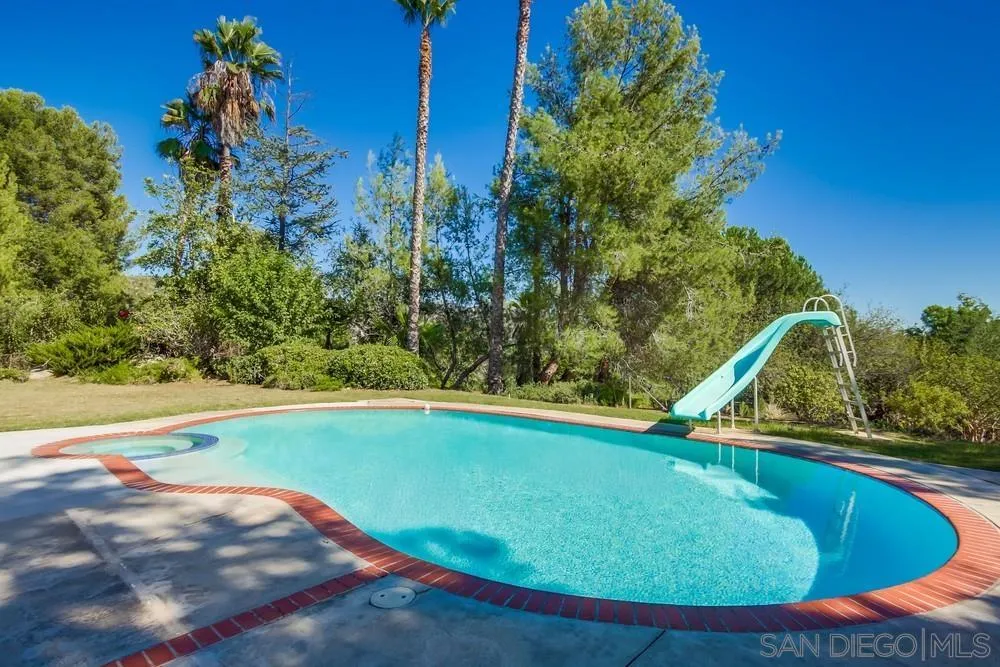 15235 Crestview Court Poway, CA 92064 - Photo 50 of 68 a view of a swimming pool with an outdoor space