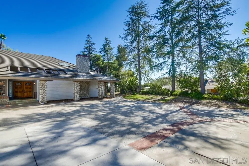 15235 Crestview Court Poway, CA 92064 - Photo 5 of 68 a view of a house with a backyard and a tree
