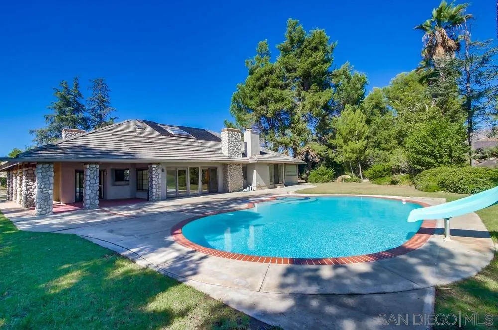 15235 Crestview Court Poway, CA 92064 - Photo 52 of 68 a view of a house with backyard sitting area and swimming pool