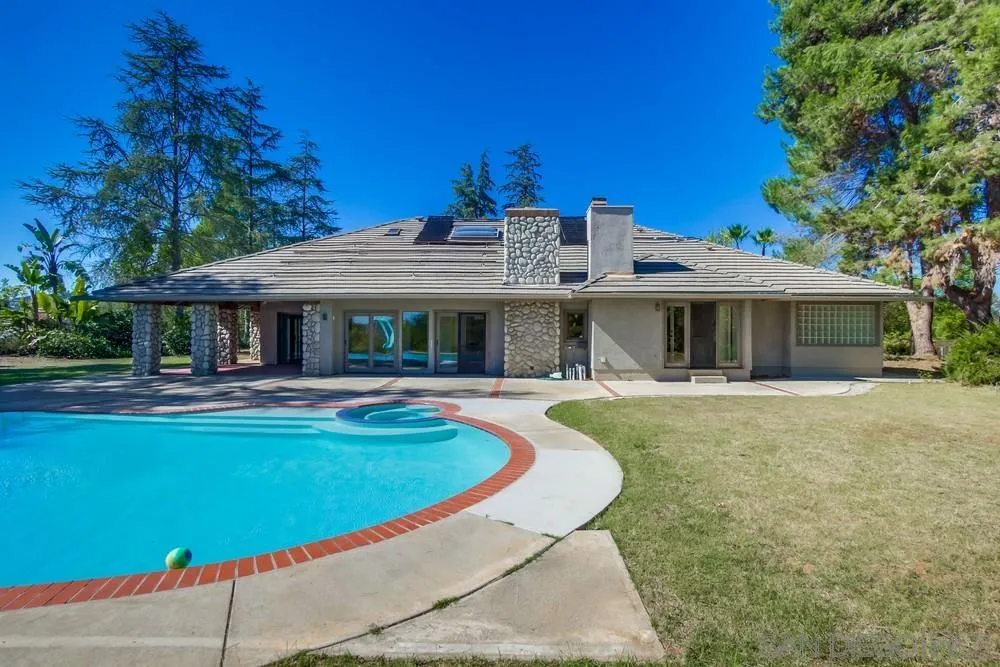15235 Crestview Court Poway, CA 92064 - Photo 56 of 68 a view of a house with swimming pool and a yard