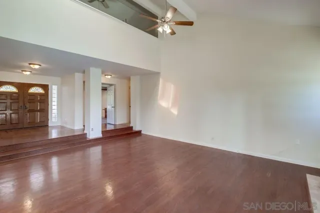 wooden floor fireplace and natural light in room