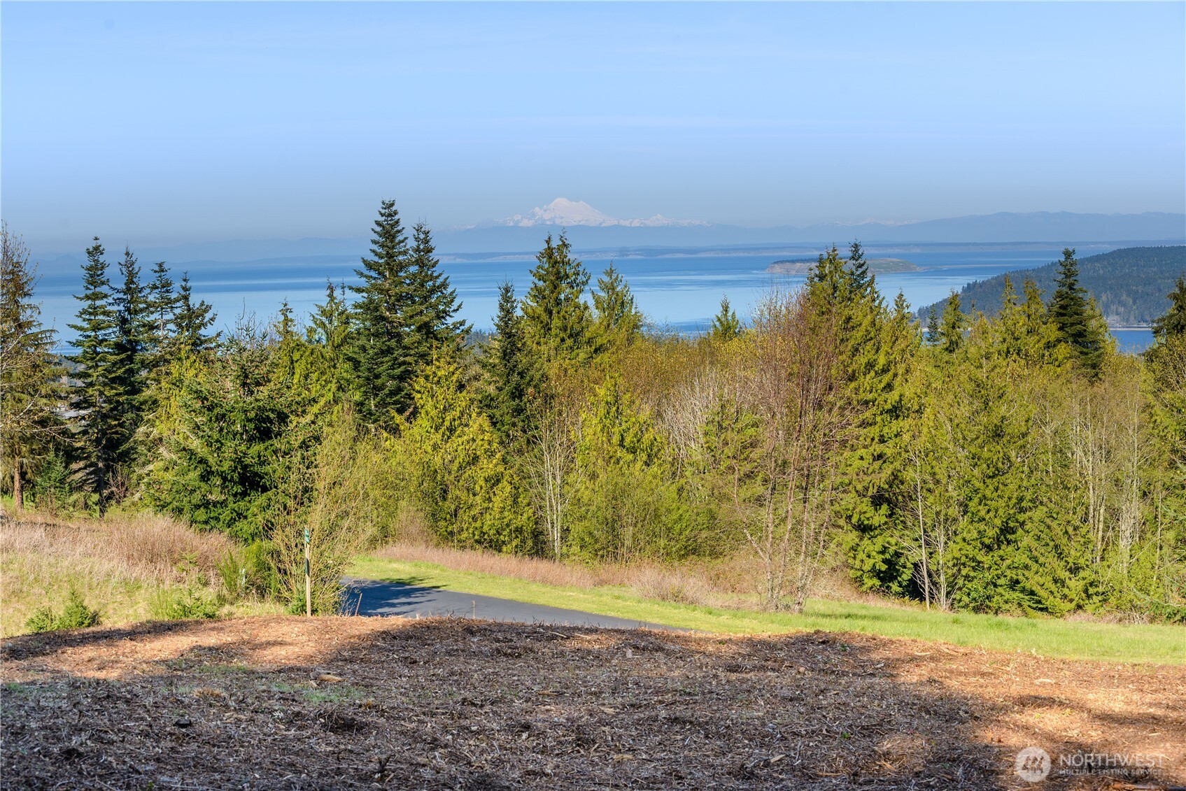 9999 Elk Pass Road Sequim, WA 98382 - Photo 1 of 13 a view of a lake with a yard
