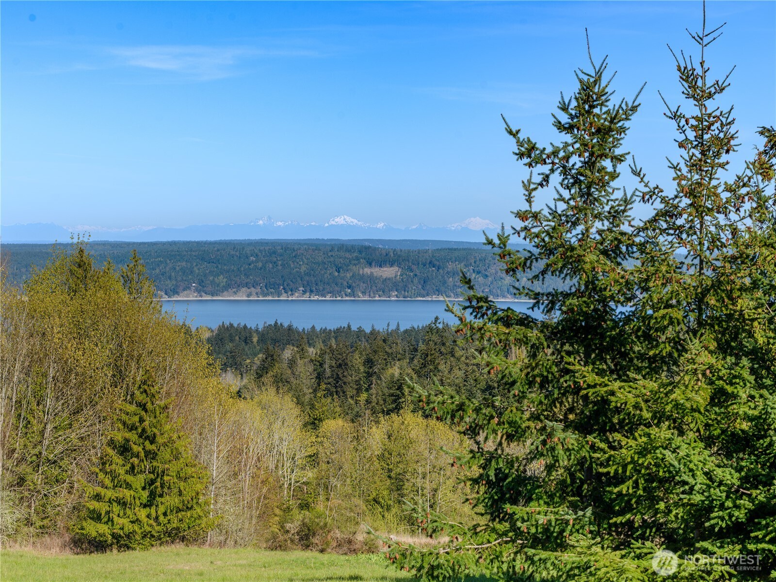 9999 Elk Pass Road Sequim, WA 98382 - Photo 2 of 13 a view of a lake with a city