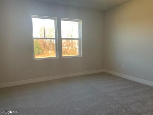 a view of a room with wooden shelves